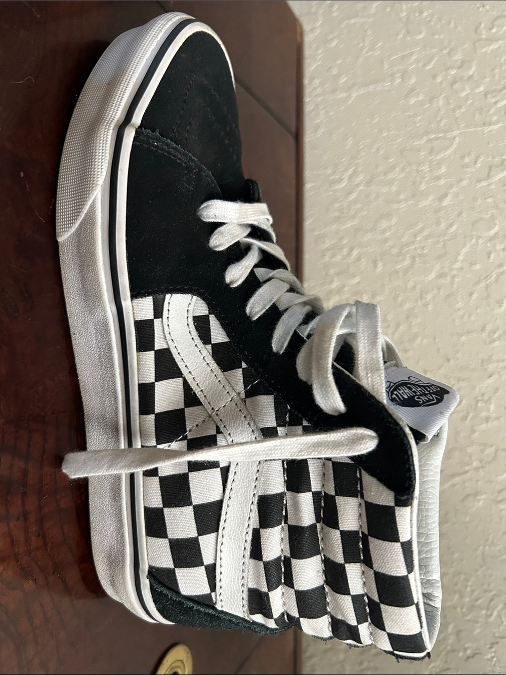Vans mens Black and White Checkerboard High-Top Sneakers